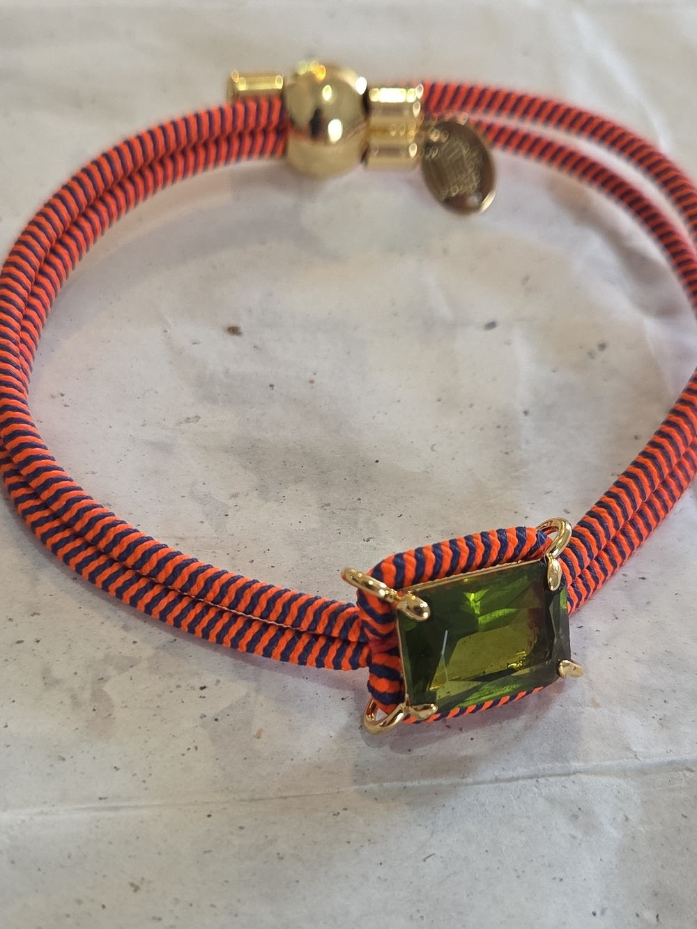Juicy Couture Gold-Tone Bracelet with Green Square Gem and Orange/Navy Cord
